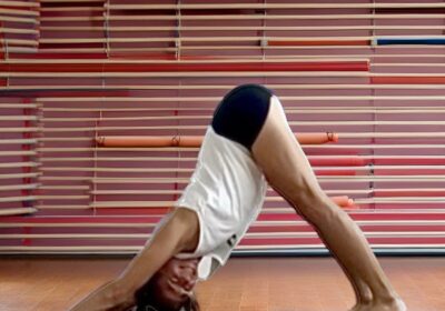 Woman practicing yoga using Flexelent squat wedges